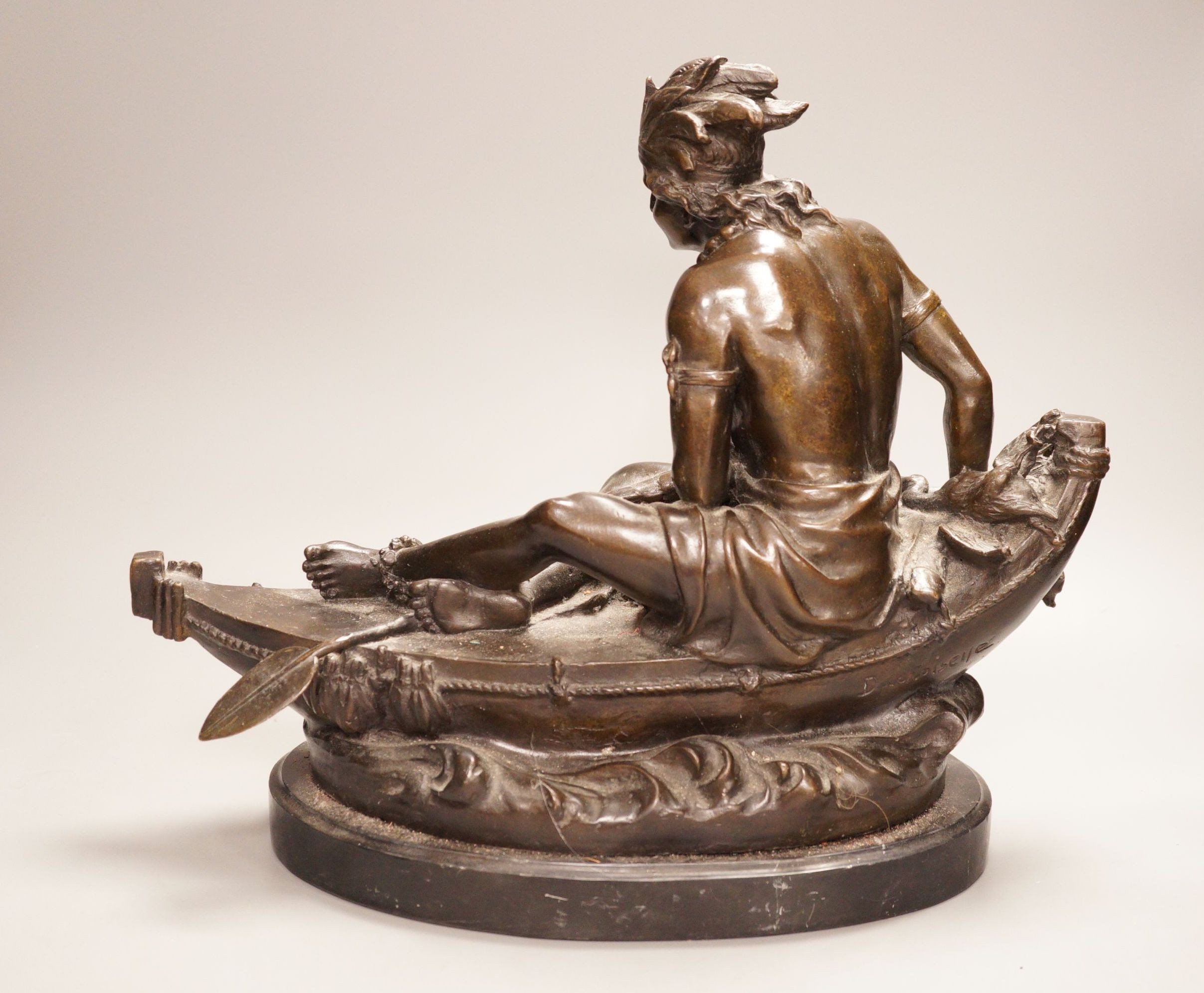 After Duchoiselle, a bronze study of a Native American huntsman in canoe, with impressed mark, on marble base, 30cm tall
